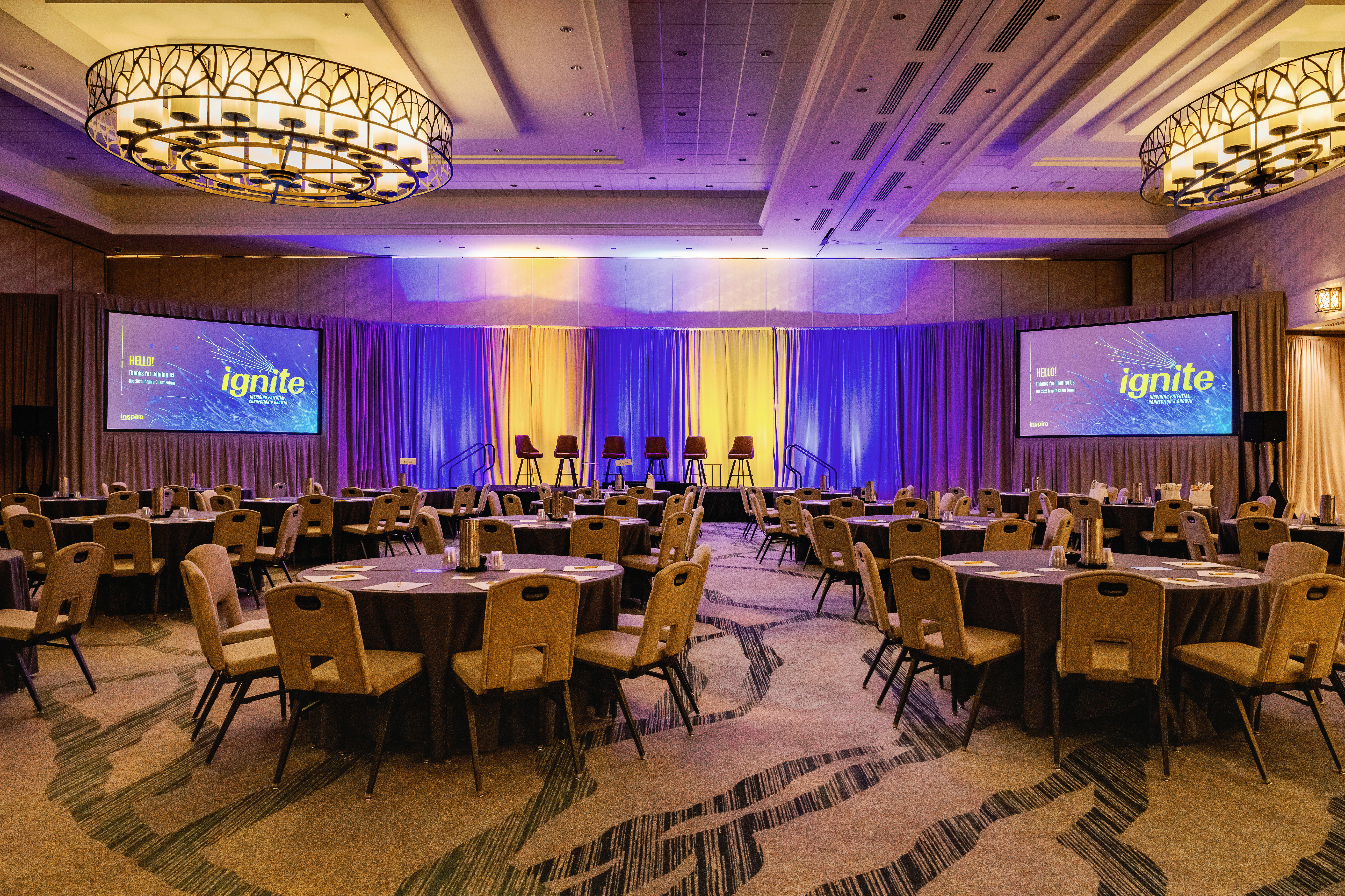 Conference attendees networking at Denver corporate event by From the Hip Photo