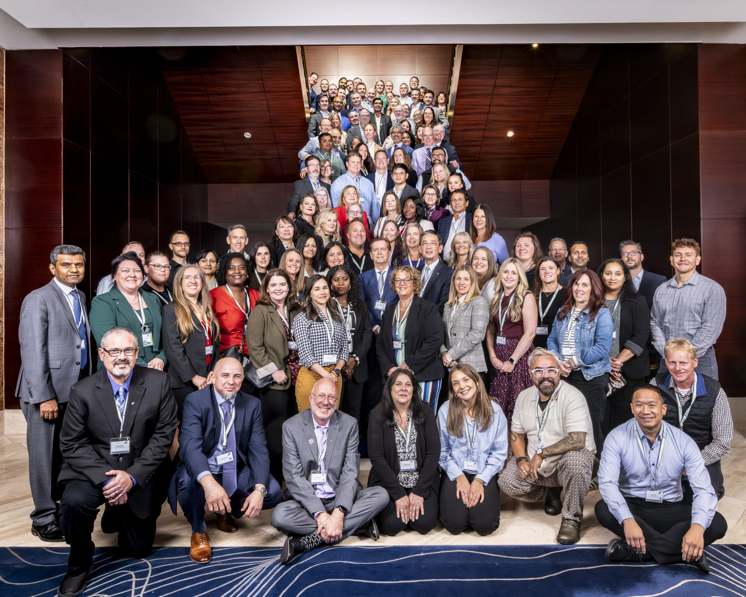 Candid conference photography showing attendee engagement at corporate event