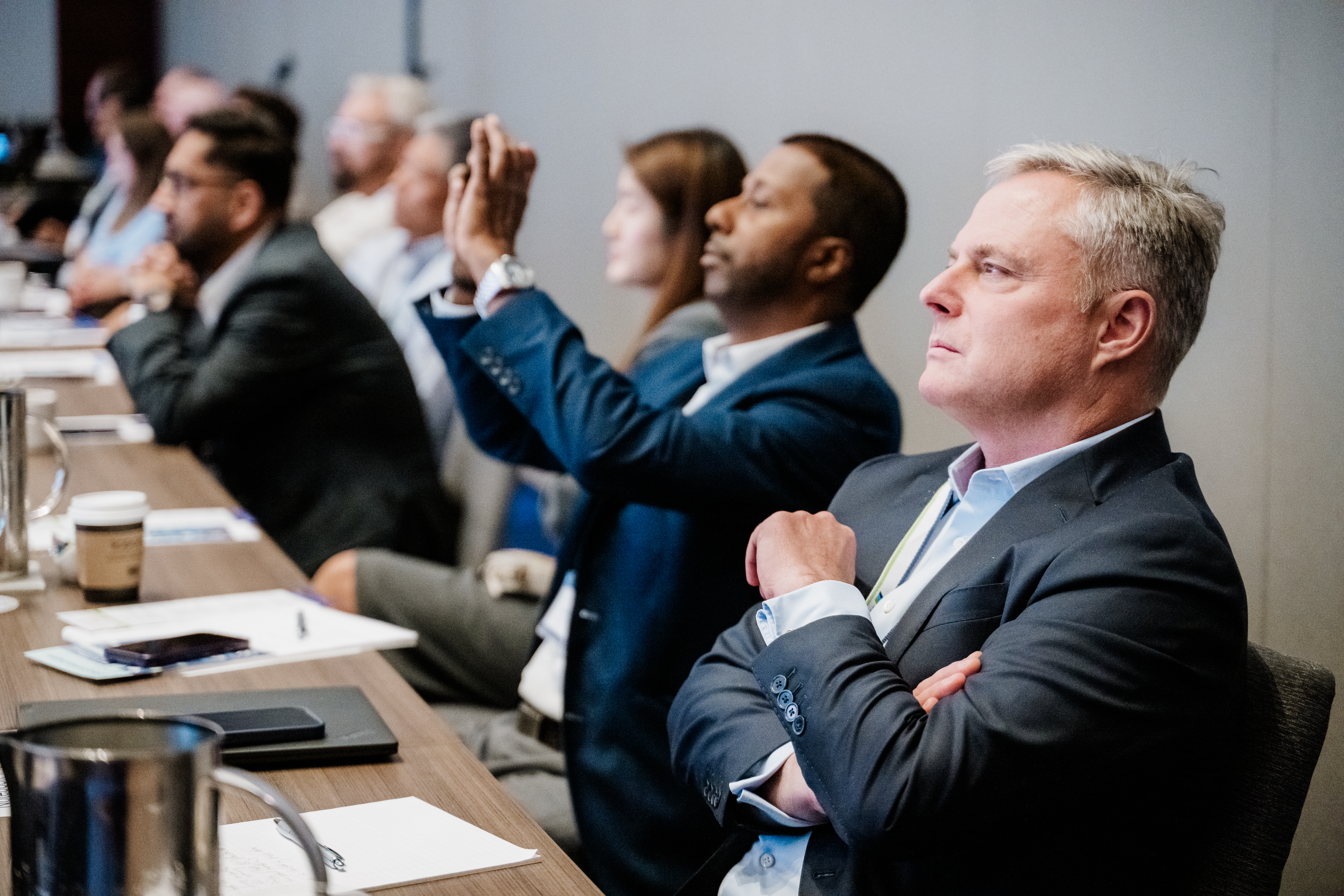Conference attendees networking at Denver corporate event by From the Hip Photo