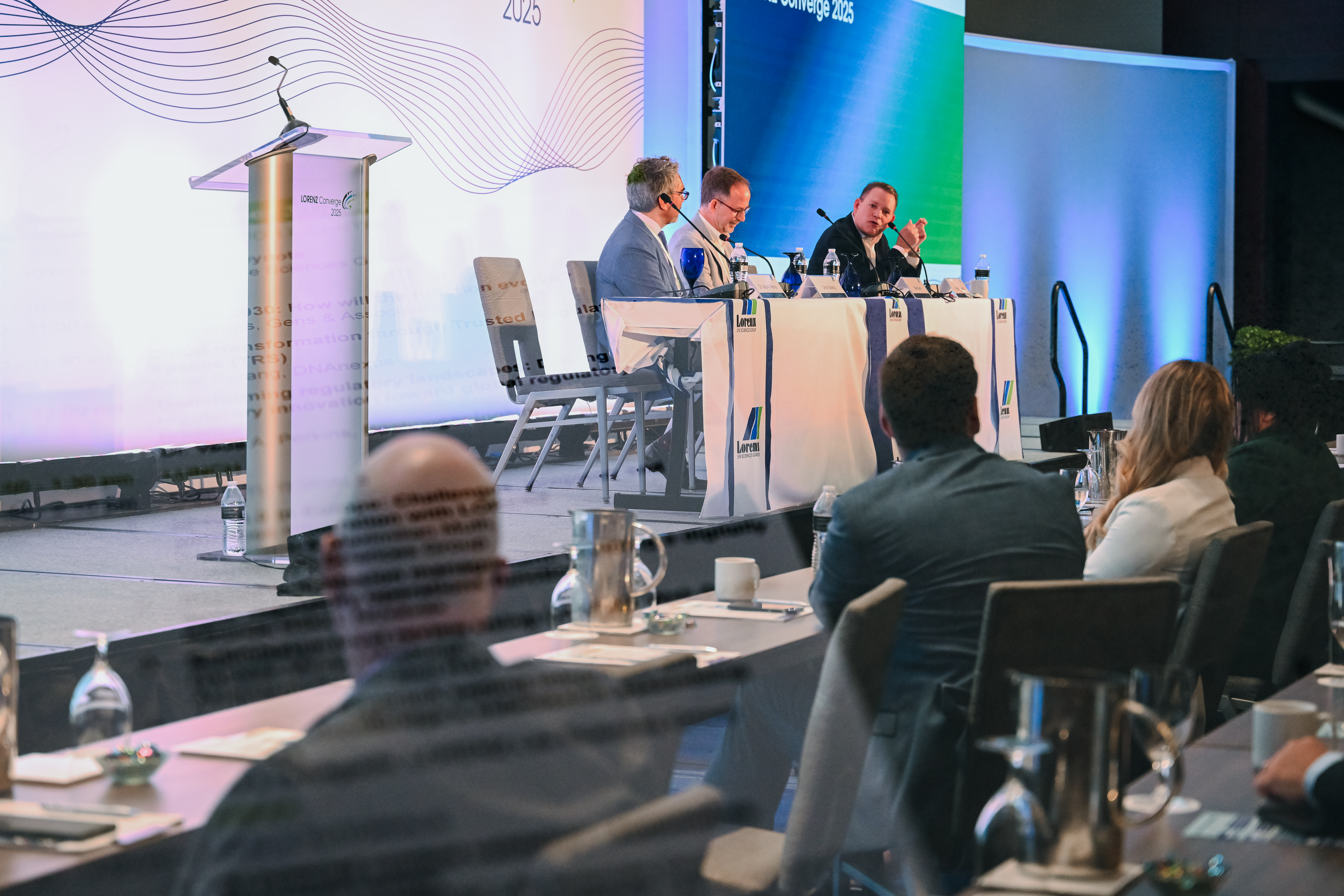 Candid conference photography showing attendee engagement at corporate event