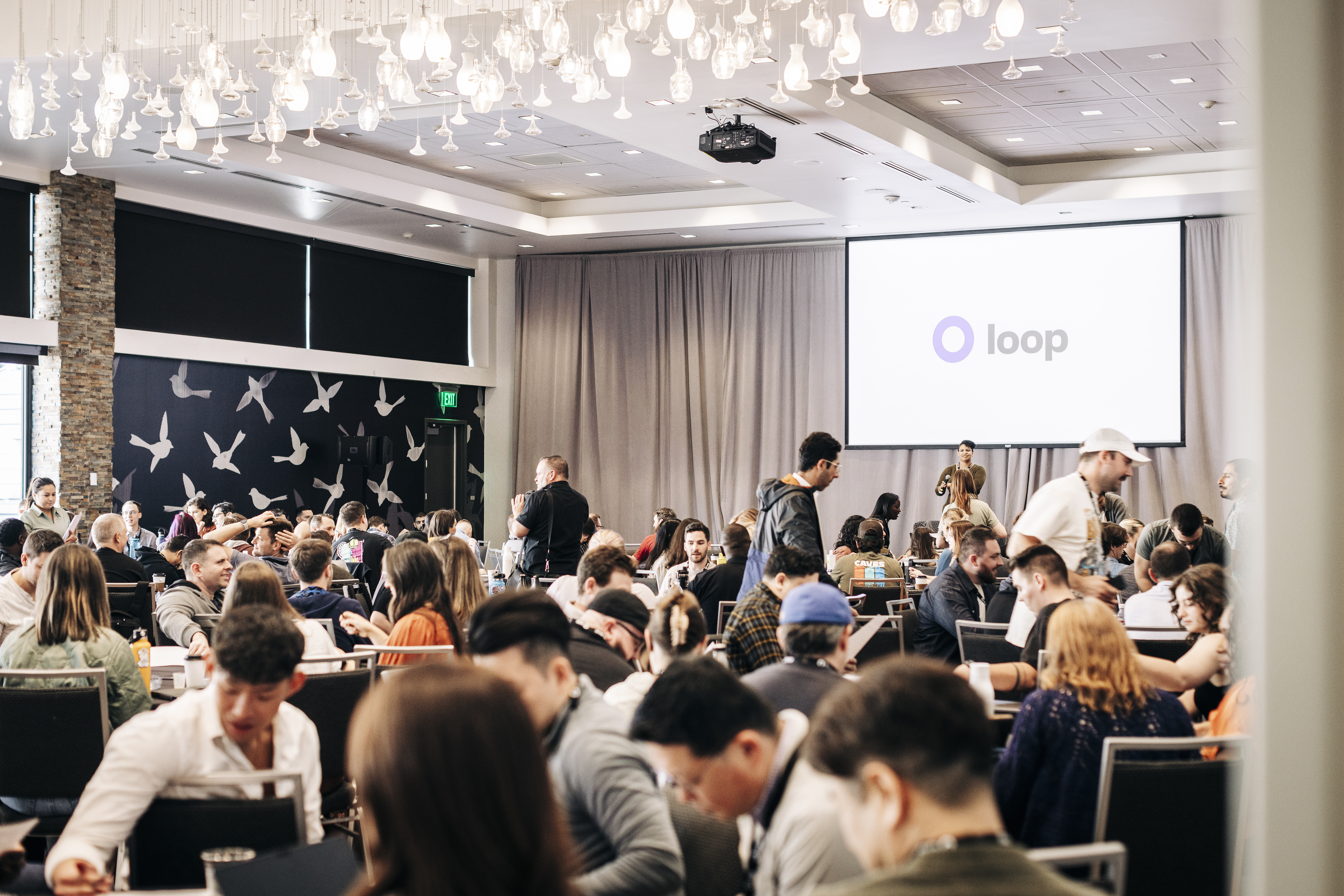 Event photography capturing speaker presentation at Denver conference