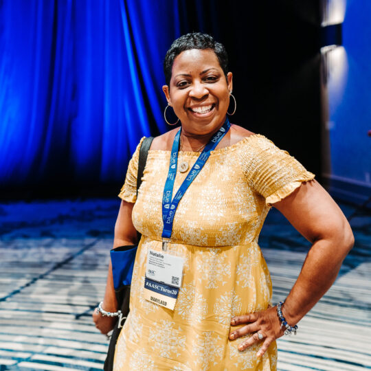 Conference attendee portrait at professional headshot station by From the Hip Photo