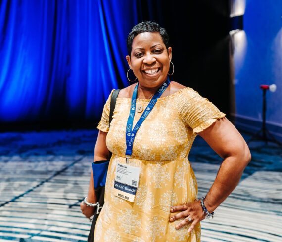 Conference attendee portrait at professional headshot station by From the Hip Photo