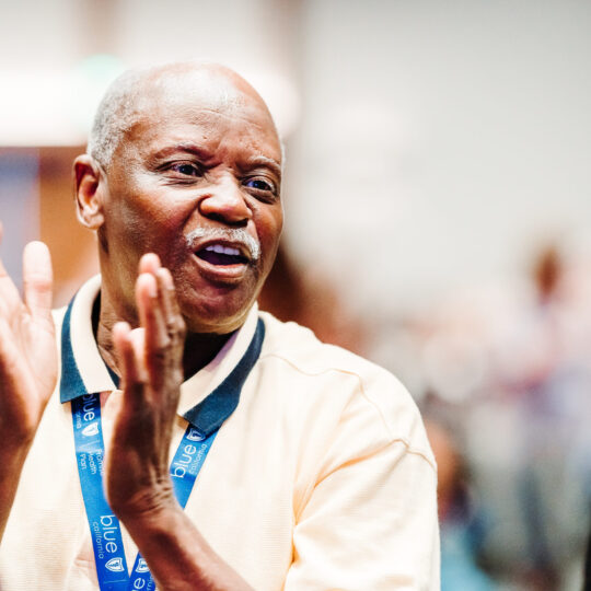 Conference session photography showing engaged attendees at corporate event