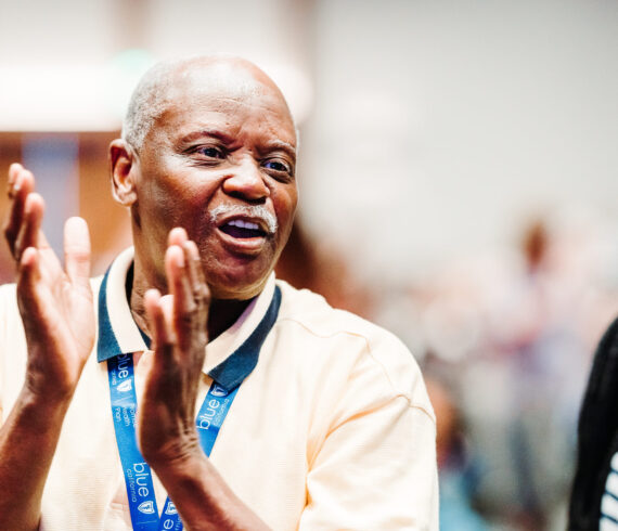 Conference session photography showing engaged attendees at corporate event