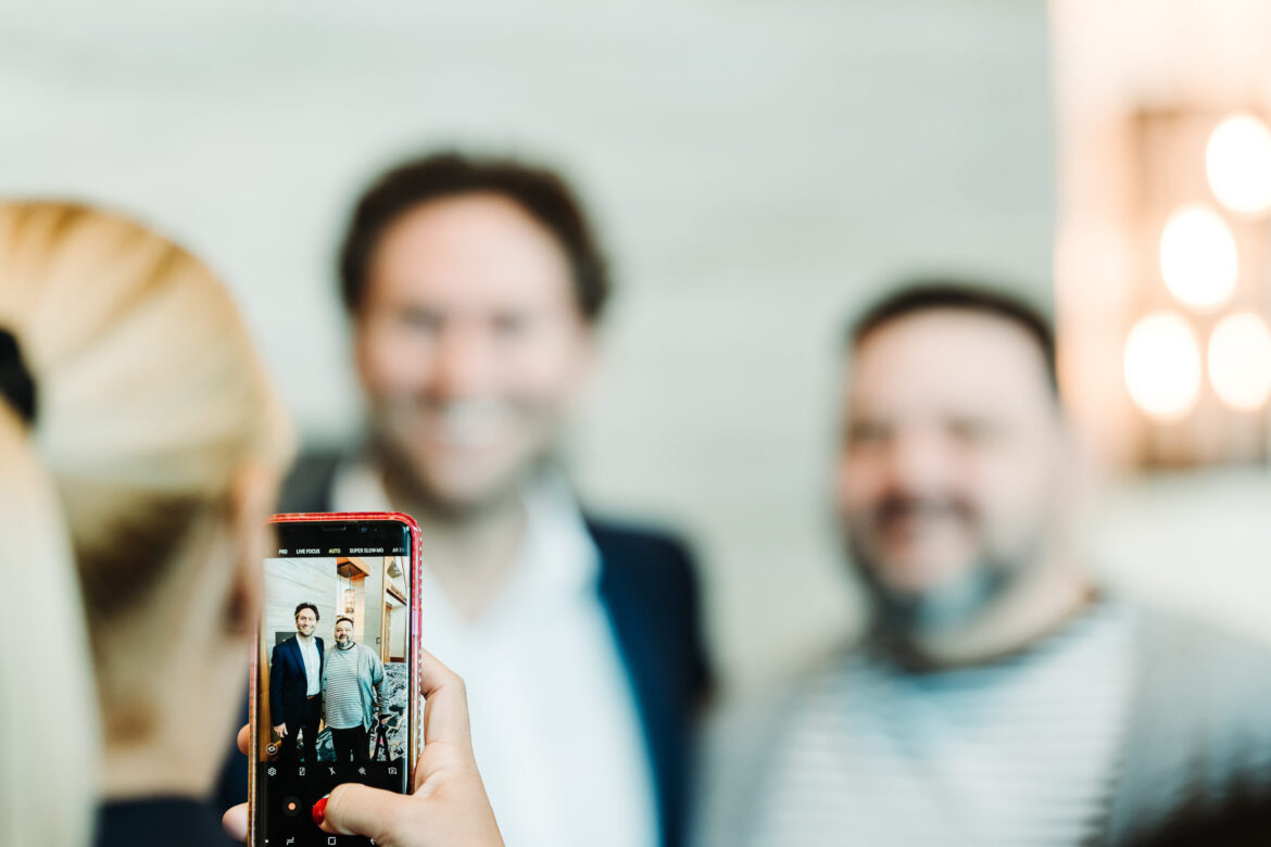 Multi-day conference coverage showing busy event floor by From the Hip Photo