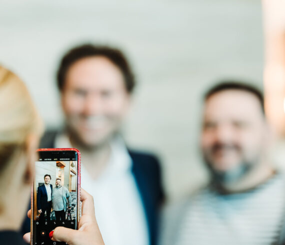 Multi-day conference coverage showing busy event floor by From the Hip Photo