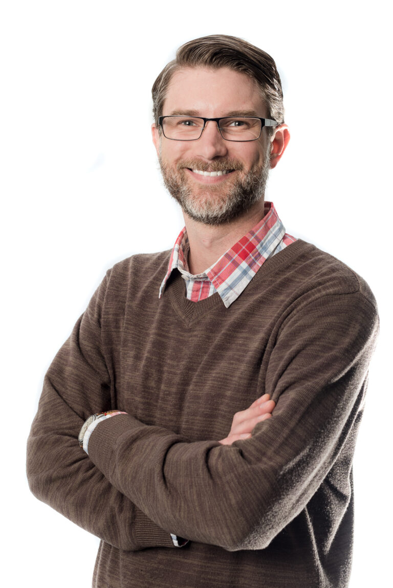 Professional conference headshot - man in brown sweater by From the Hip Photo