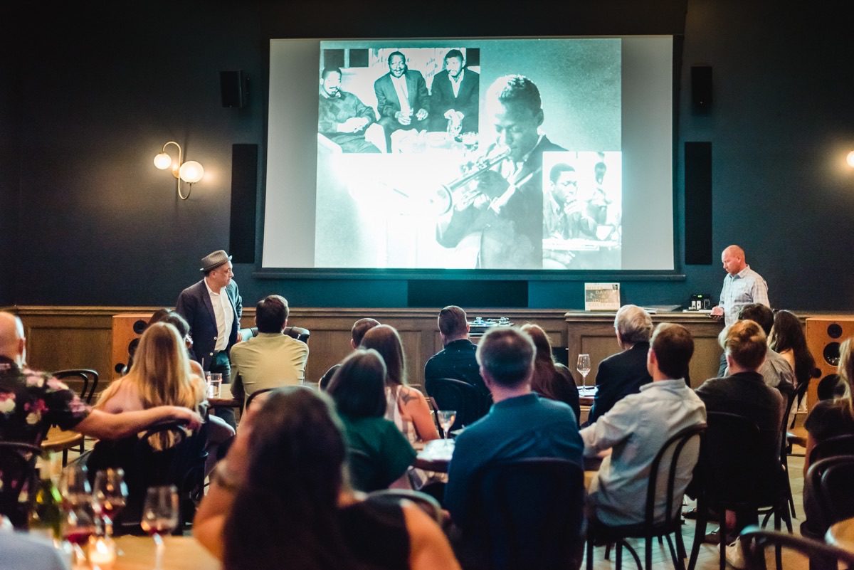 Presenter at annual meeting session with seated audience